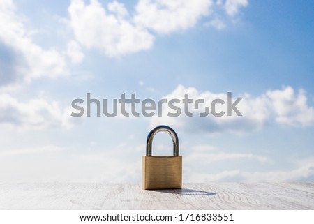 padlock with a blue sky as a background