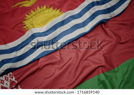 waving colorful flag of belarus and national flag of Kiribati . macro