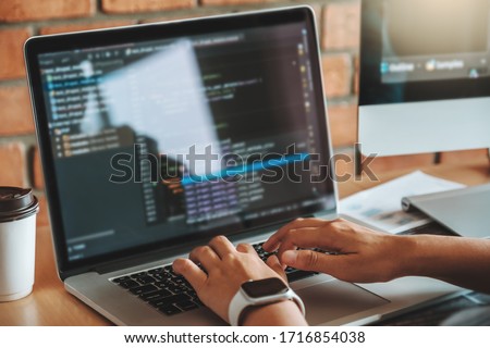 Developing programmer team reading computer codes Development Website design and coding technologies Royalty-Free Stock Photo #1716854038