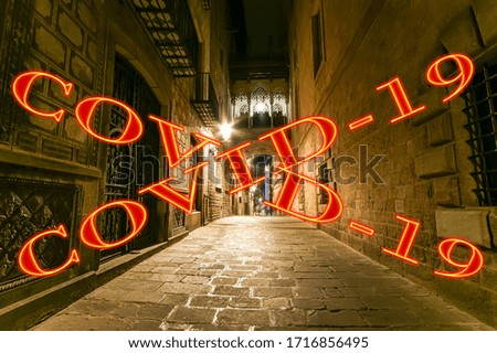 Coronavirus in Barcelona, Spain. Covid-19 sign. Concept of COVID pandemic and travel in Europe. Gothic quarter at night. Empty alleyways 