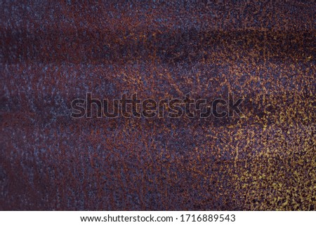dark background with purple and yellow rust and space pattern