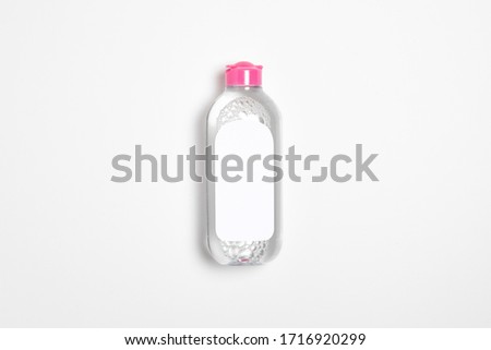 Micellar water bottle with blank label isolated on white background.Makeup remover, natural moisturizing lotion Mock-up. Transparent liquid container.High resolution photo.