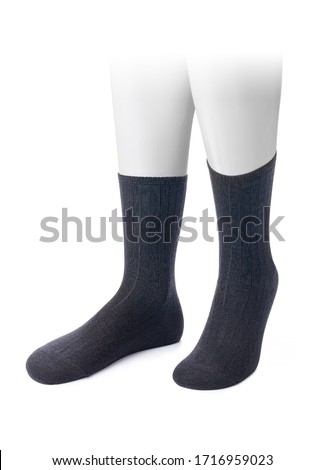 Blue color socks isolated on white background. One pair of socks. Set of dark blue or navy blue socks for sports on invisible foot as mock up for advertising, branding, design.