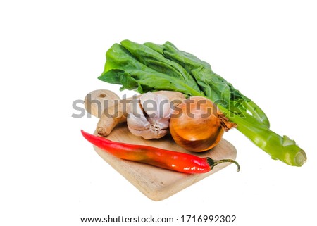 Chinese kale, chinese broccoli ,chili, onion, garlic,  and potato isolated on white background