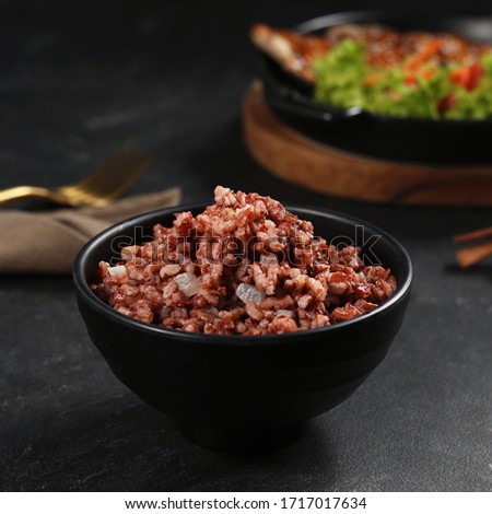 Organic Red Steamed Rice on Bowl, Rich of Antioxidant Called Anthocyanin Which is Believed to Have Properties That Can Help in Weight Management. Suitable Stock Photo For Your Web, Blog, Social Media