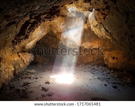 Sun Beams Shine Down Through Cave Ceiling 2