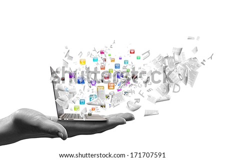 Close up of hand with laptop and media icons