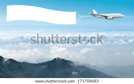 Download An Airplane Flying Through The Sky Pulling A Royalty Free Stock Photo 184230170 Avopix Com