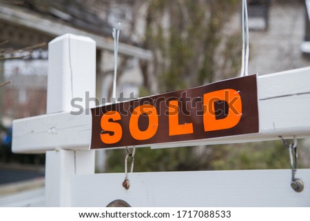 Sold sign. Selling a house. Buy a house. Sell a house. New home.