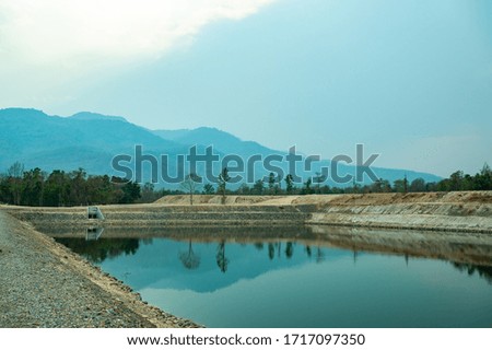 Reservoir with mountain view in Chiang Mai province, Thailand.