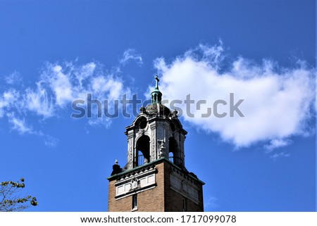 Architectural photo of a Catholic Church steeple located in Bronx County New York
