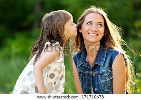 portrait of mother and daughter in nature