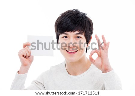 Young asian man showing empty card isolated on white background. 