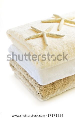 Stack of soft towels isolated on white background