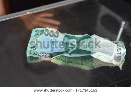Indonesian banknotes with twenty thousand denominations on the table
