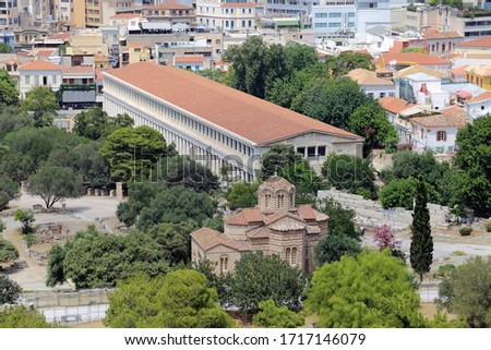 Athens, Greece - June 25, 2016: The Stoa of Attalos structure, which was an ancient market reconstructed in the 1950s, is shown during the day, located just beyond the Church of the Holy Aspostles.