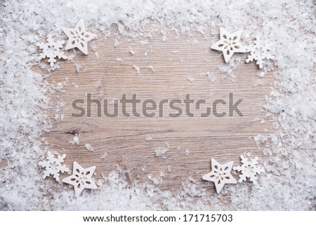 wooden background with artificial snow
