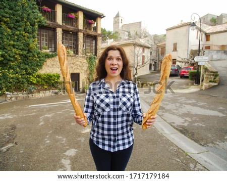 Funny picture of crazy woman eating tasty loaf. Overweight, overeating and hunger concept.