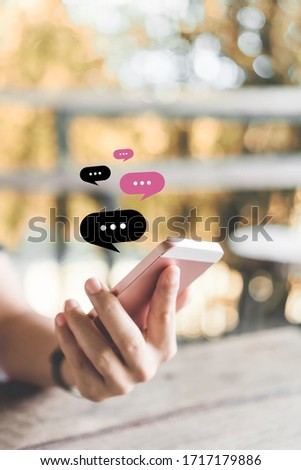 Woman hand using smart phone at coffee shop with email icon flying and line dot abstract. Technology business and freelance concept. Vintage tone filter effect color style.