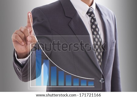 Businessman pushing a graph 