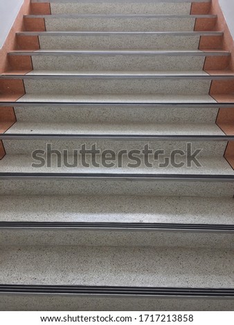 Stair steps leading up and down. Abstract stair inside the building. Stairway and cloudy background. Bustiness concept