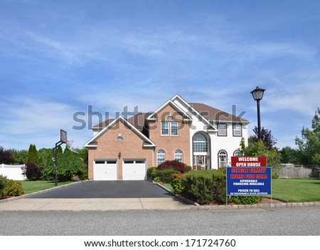 For Sale Real Estate Open House sign Suburban McMansion style brick home Landscaped sunny residential neighborhood USA blue sky clouds