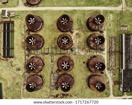 Abandoned chemical plant with rusty and unused production buildings. Aerial view photo. 