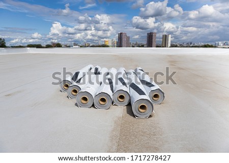Roofing PVC membrane in rolls. Industrial roof. Royalty-Free Stock Photo #1717278427