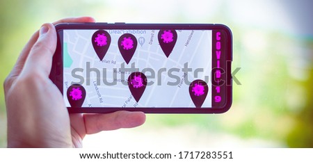  contact tracing app horizontal background with hand holding cell phone Royalty-Free Stock Photo #1717283551