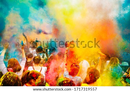 Holi color festival. Celebrating dances. Throwing colored powder. Spring Festival. Royalty-Free Stock Photo #1717319557