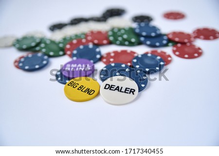 Close-up picture of poker chips scattered on white background table. Gambling addiction. Play table games. Stay home.