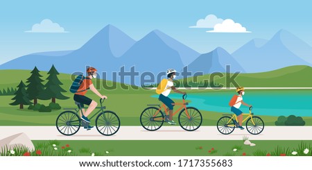 Happy traveling family spending time outdoors, they are cycling together in nature and wearing protective face masks