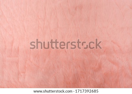 Colorful pink artificial fur soft and worm texture. Faux fur use for background