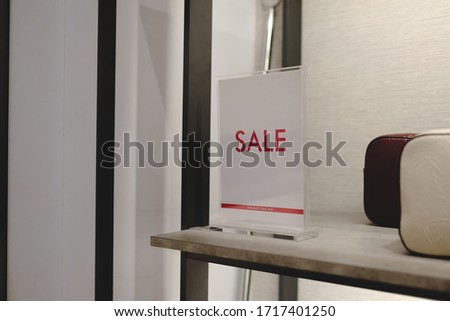 sale off mock up advertise display frame setting over the shelf in the shopping department store for shopping, business fashion and advertisement concept.