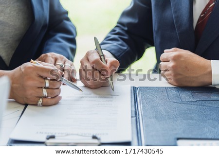 Businessman sign the contract, the agreement in the document.