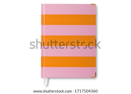 Top view of golden cornered light pink and orange horizontal striped leather personal planner with a bookmark isolated on white background.