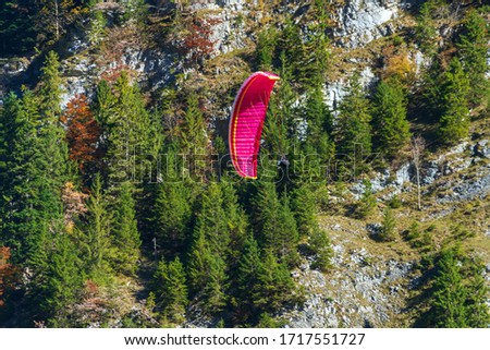 Paraglider sportsmen in Alps mointains, Berner Oberland, Switzerland