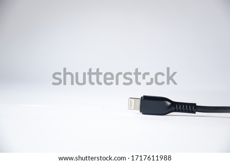 Charging cable for phone on a white background, for iPhones.