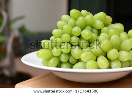 Green fruit salad ,Green grape ,juice, Bucket Gift for vegetarian.Fruit for healthy lover serve on white dish.