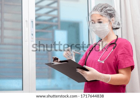 Doctor medical checking information consulting patient for outbreak COVID-19 Epidemic virus outbreak concept . Medical staff in Face Shield and medical mask for Prevention of coronavirus pandemic .