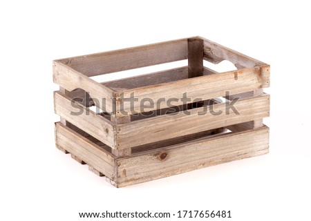 Small wooden box crate used for fruit or vegetables on a farm or shop. Slatted pine crate isolated on a white background Royalty-Free Stock Photo #1717656481
