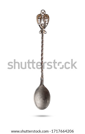  beautiful silver antique teaspoon isolated on white background