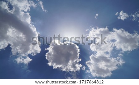 Sun beams or rays breaking through the white clouds. Hope, prayer, God's mercy and grace. Beautiful spectacular conceptual meditation background. Artistic sunset edit.