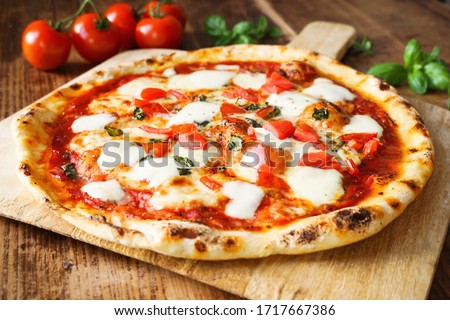 Fresh Homemade Italian Pizza Margherita Royalty-Free Stock Photo #1717667386