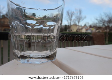 Drink glass sitting on a table outside