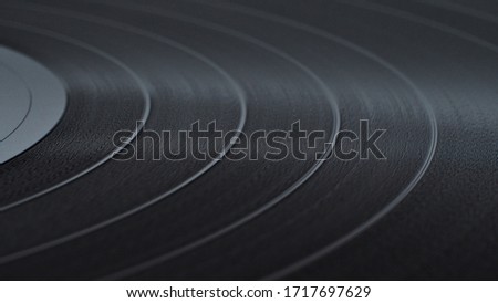 Black Vinyl Disc Record  with recorded music, close-up. Royalty-Free Stock Photo #1717697629