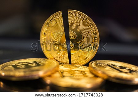 Bitcoin halving. Block reward gets cut in half every four years for crypto miners. Royalty-Free Stock Photo #1717743028