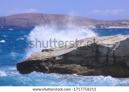 Breaking wave at Sarakiniko beach, Milos island, Cyclades, Greece. Milos is one of the southern Cyclades islands in the archipelago