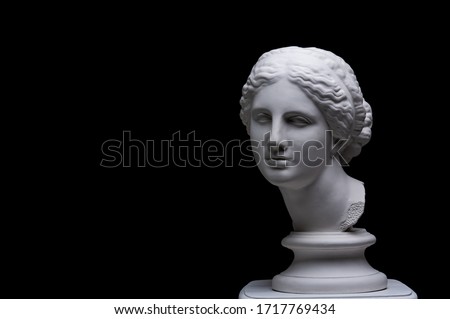 Gypsum copy of ancient white statue of bust of Venus with black background .Plaster sculpture woman face. The goddess of love in Greek mythology. Renaissance epoch.