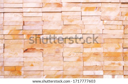 Wooden planks geometric 
background - Stack of rough pine boards light brown color - Image